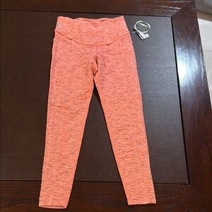 NWT movement free people orange leggings size small